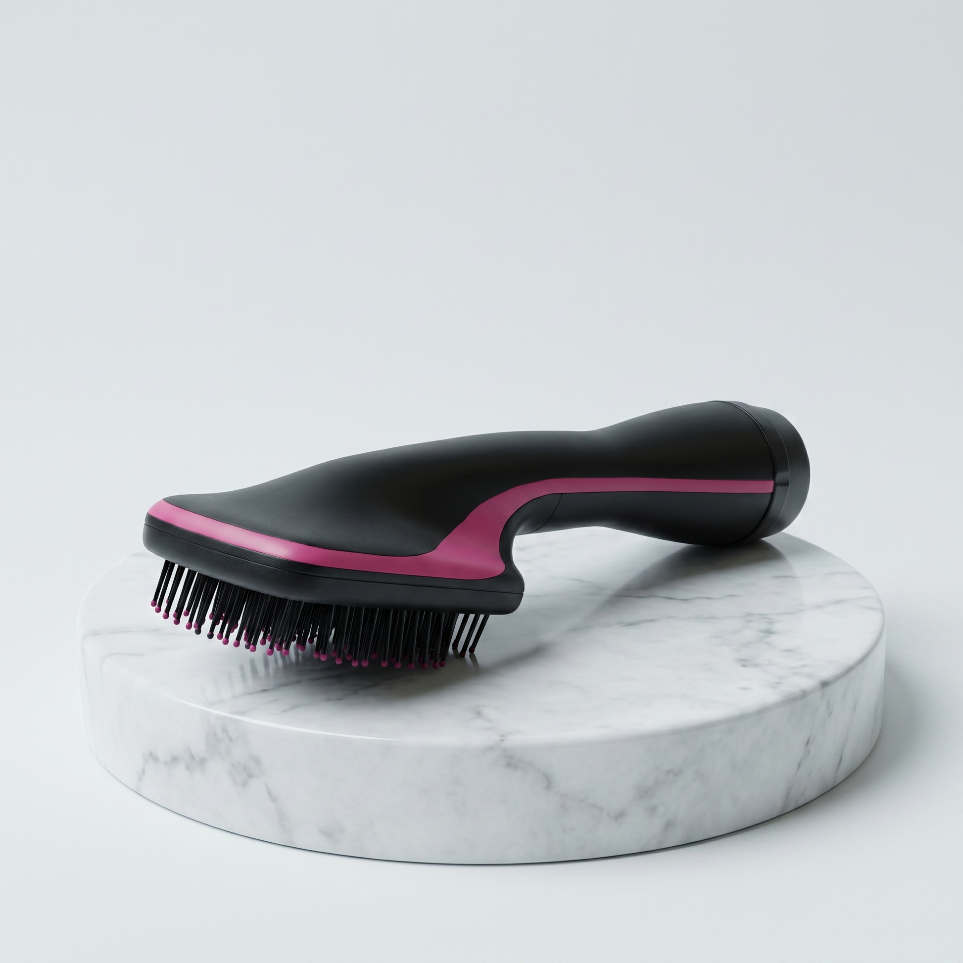One-Step Hair Dryer Brush and Comb, black with pink accent, on a marble pedestal