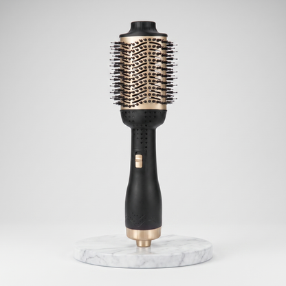 Hot air brush anti-frizz straightener in black and gold on a marble pedestal