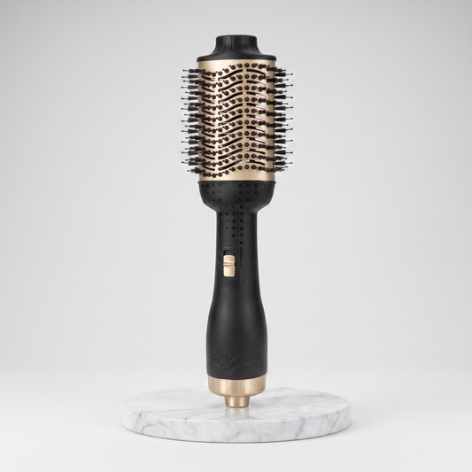 Hot air brush anti-frizz straightener in black and gold on a marble pedestal