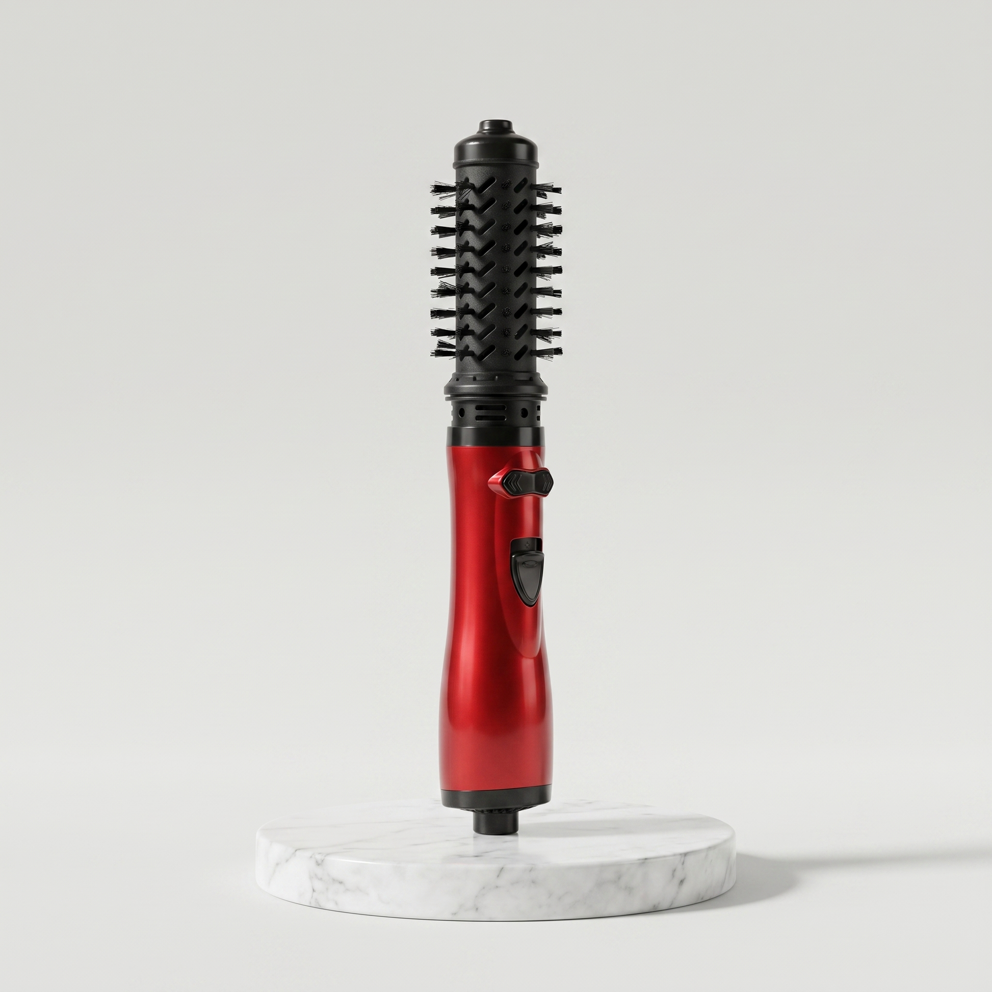 Rotating hot air brush hair styler in red on a marble pedestal