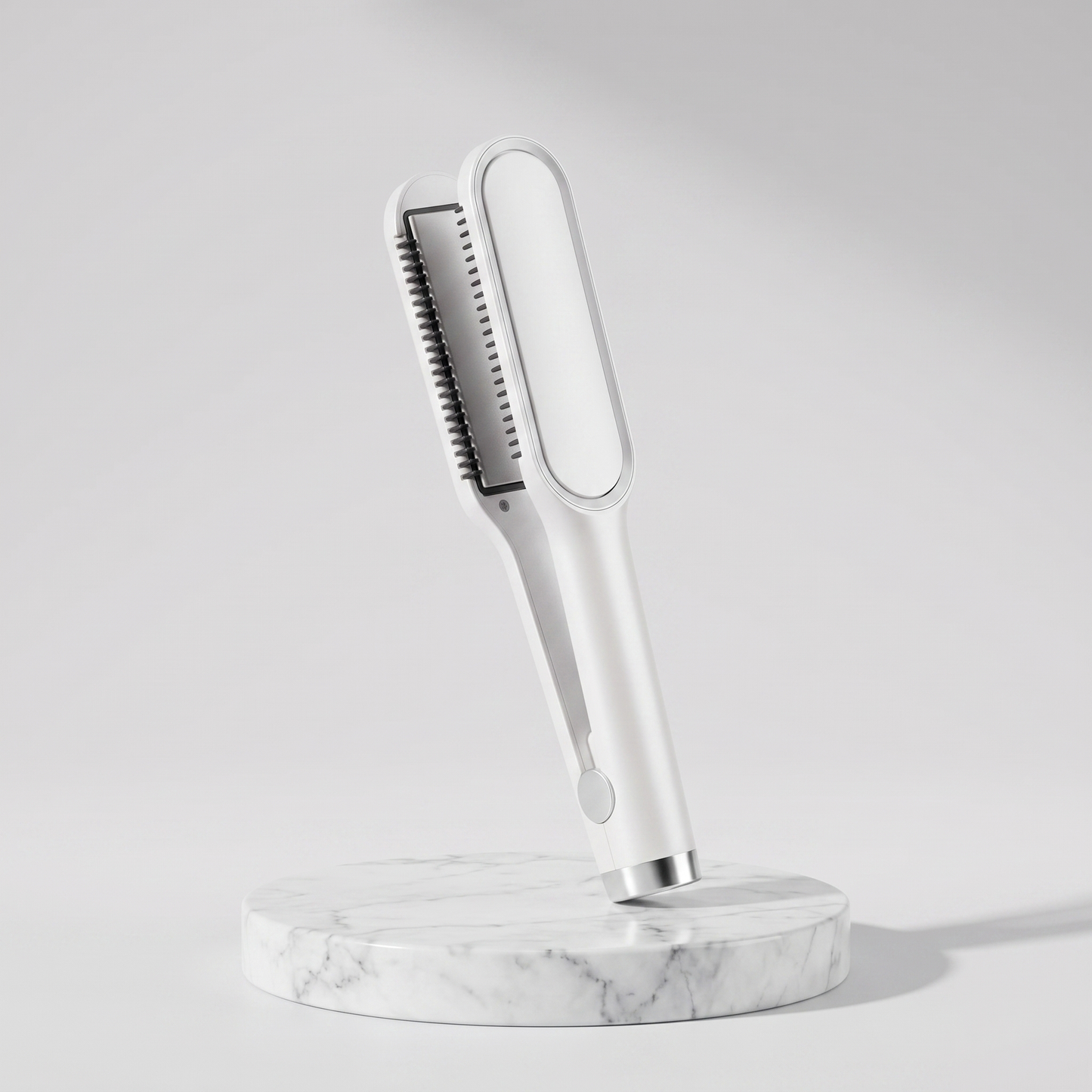 2-in-1 ceramic hair straightener brush in white on a marble pedestal
