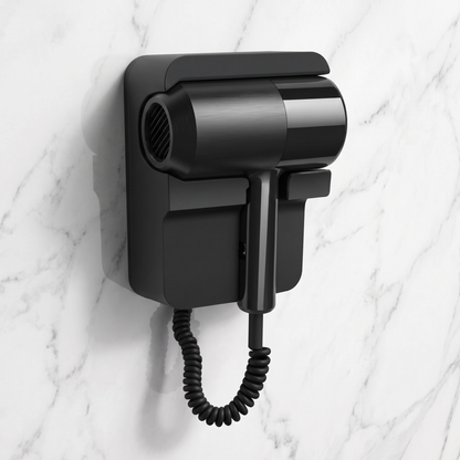 Black wall-mounted hair dryer with coiled cord mounted on a marble wall