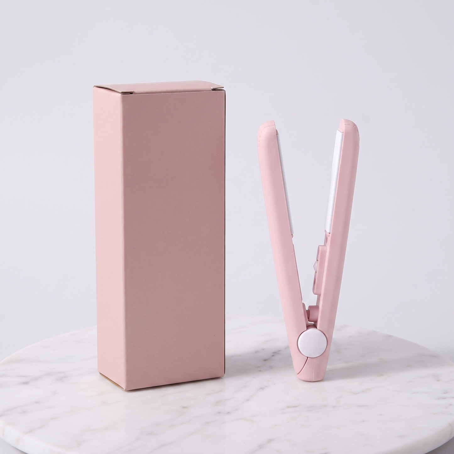 Mini flat iron hair straightener with plain pink retail box